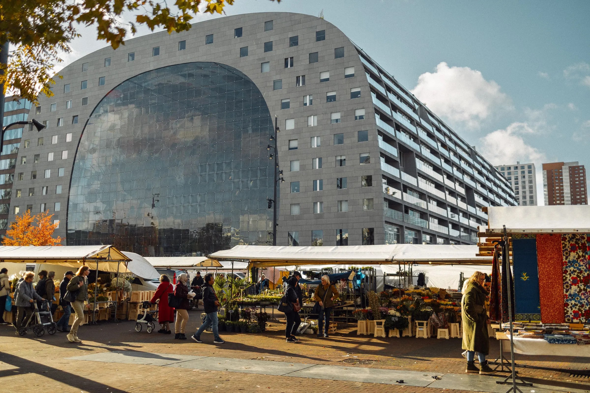 The Markthal in Rotterdam with market stalls in the foreground