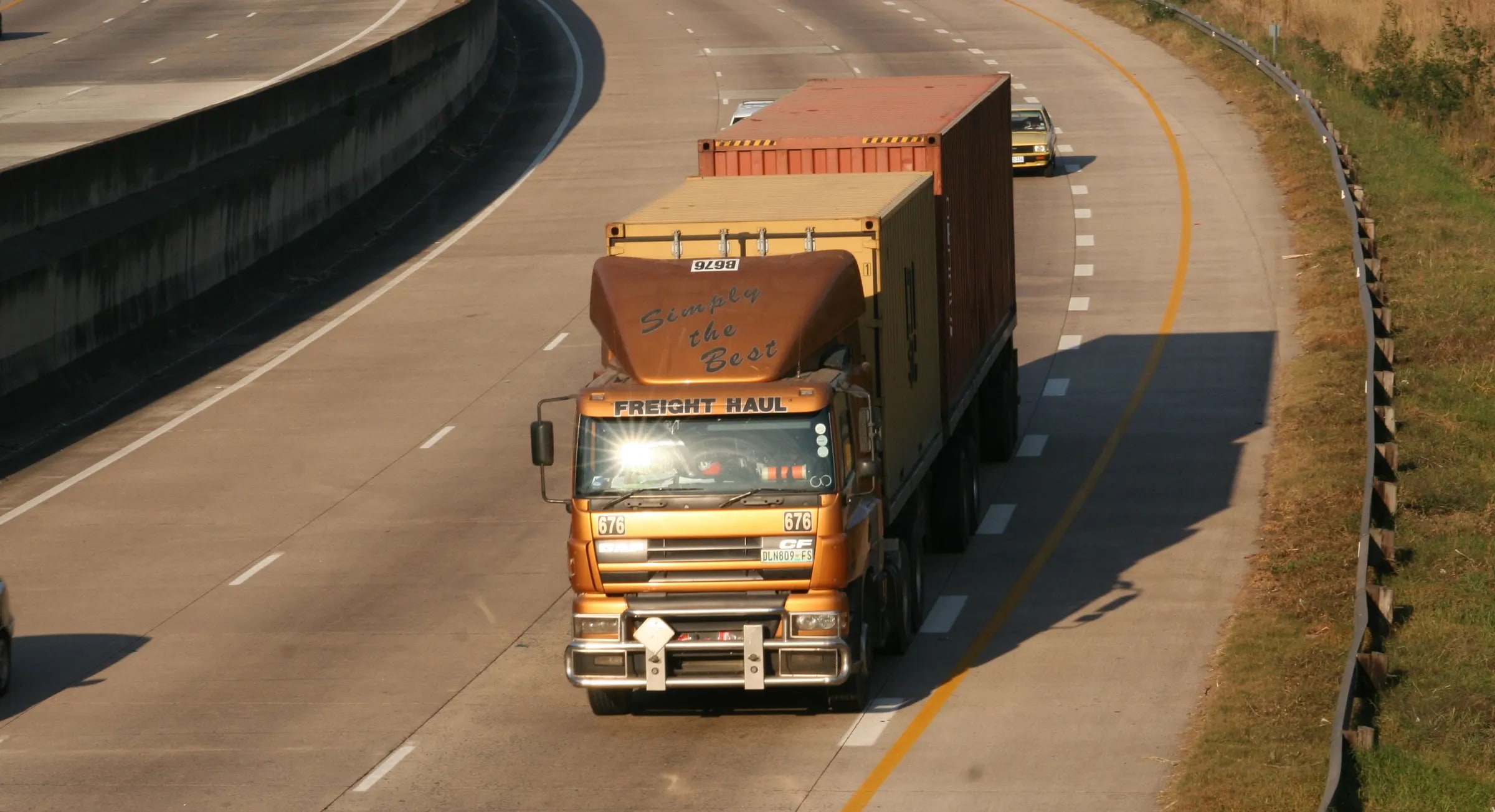 A truck with containers driving along the motorway