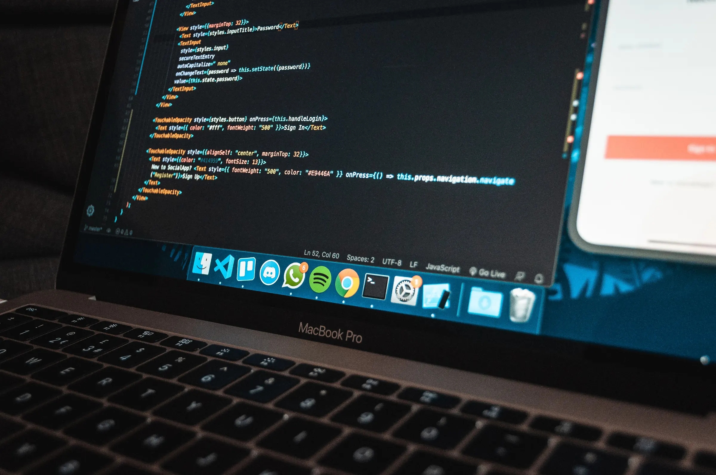 A laptop showing program code in an editor